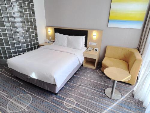 Postel nebo postele na pokoji v ubytování Holiday Inn Express Shijiazhuang Heping by IHG
