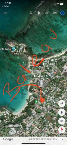 a map of a beach with red writing on it at Baleau Villas Studio in Pereybere