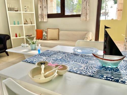 a table with two bowls on top of a table at Sermilie Beach Houses in Psakoudia