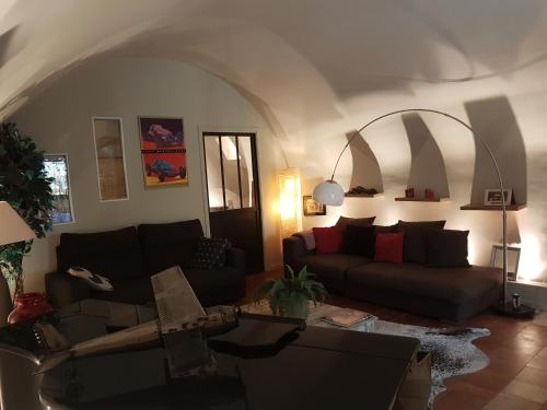 a living room with a couch and a table at Bastide en Provence in Auriol