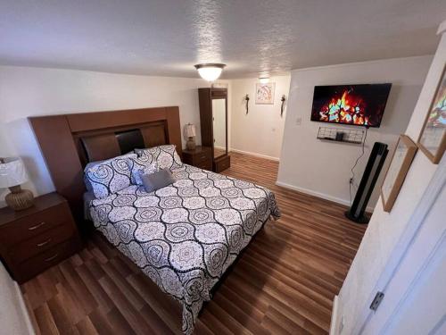 a small bedroom with a bed and a fireplace at The Heart Of Cruces in Las Cruces