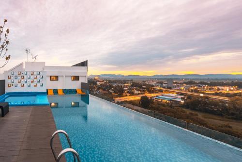 a pool on the roof of a building with a view at ALOR SETAR IMPERIO PROFESSIONAL by ZUES in Alor Setar