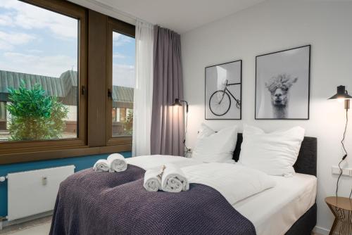 Кровать или кровати в номере BRIGHT Lippstadt Klusetor