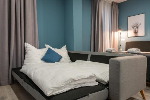 Кровать или кровати в номере BRIGHT Lippstadt Klusetor