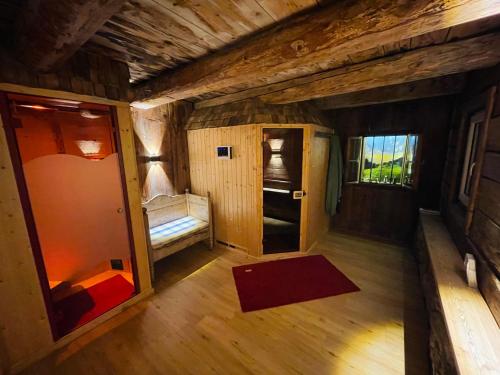 an inside view of a small room with a kitchen and a door at Arlerhof in Untertauern