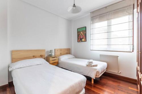 Postel nebo postele na pokoji v ubytování Precioso apartamento en Sopela