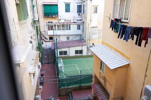 a view of a tennis court on a street between buildings at Toto e Peppino Luxury Rooms in Naples