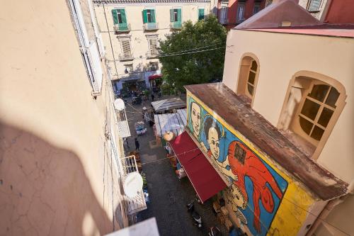 an overhead view of a street with graffiti on a building at Toto e Peppino Luxury Rooms in Naples