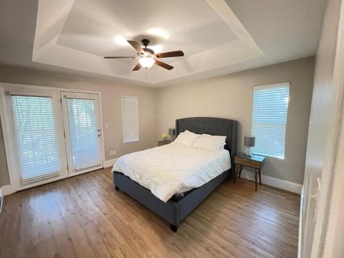 a bedroom with a bed and a ceiling fan at Sweet Home Atlanta in Atlanta
