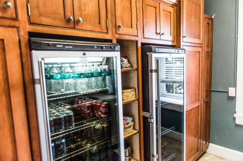 a kitchen with an open refrigerator filled with drinks at Marriott Ranch Bed and Breakfast in Hume