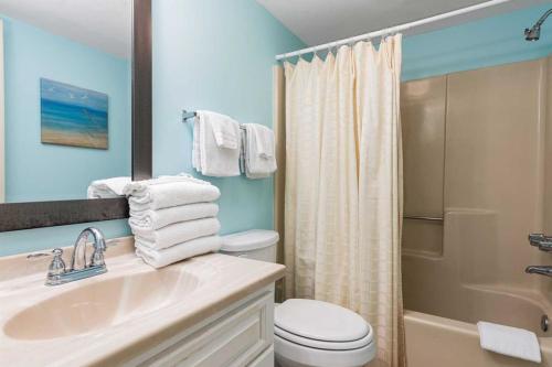 a bathroom with a sink and a toilet and a shower at Lei Lani Village 114 in Orange Beach