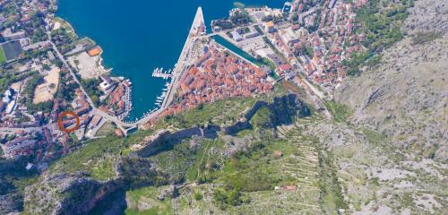 an aerial view of a mountain with houses on it at Stylish apartment 22 in Kotor