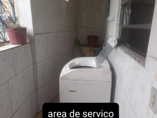 a small bathroom with a toilet and a sink at Apartamento zona norte in Rio de Janeiro