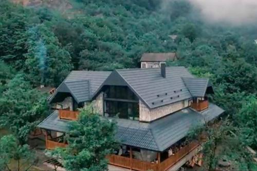 an aerial view of a house in the forest at Balkonum Luxury Guest House in Gosh