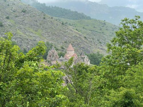 an old building in the middle of a mountain at Balkonum Luxury Guest House in Gosh