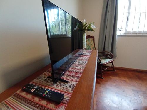a dining room table with a television on top of it at Amplio departamento, la mejor ubicación en Mendoza in Mendoza