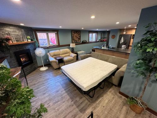 a living room with a couch and a table at Beautiful Suite In Cranbrook! in Cranbrook