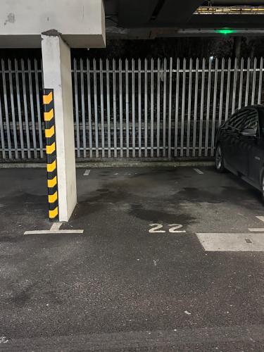 a car parked in a parking lot next to a fence at Pier Road in London