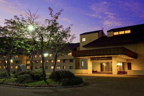 a building with a street light in front of it at Niseko Northern Resort, An'nupuri in Niseko