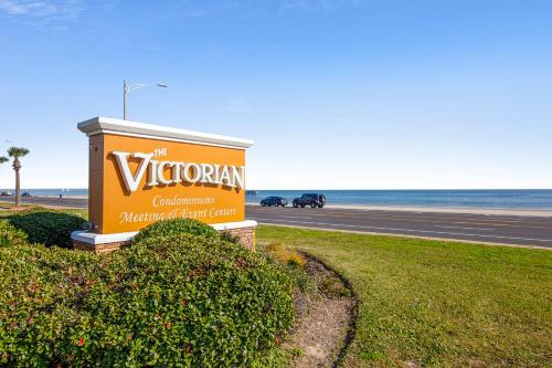 a sign for the virginian restaurant at the beach at Victorian 9203-Ocean Oasis in Galveston