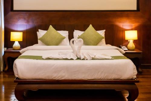 Ένα ή περισσότερα κρεβάτια σε δωμάτιο στο Sada Hotel