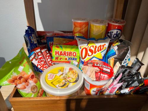 a drawer filled with different types of snacks and drinks at En nho Homestay SaPa in Sa Pa