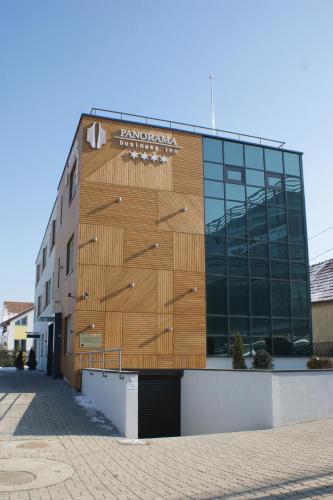 a building with a sign on the side of it at Panorama Business Inn in Cluj-Napoca