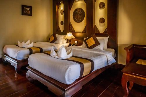 Ένα ή περισσότερα κρεβάτια σε δωμάτιο στο Sada Hotel