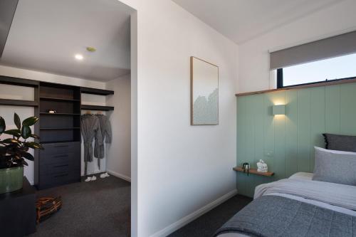 a bedroom with a bed and a window at Little Jem in Daylesford