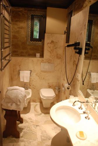a bathroom with a sink and a toilet and a shower at Castello Di Monterone in Perugia