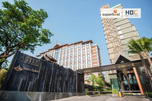 a building in the middle of a city at Modern 2-Bedroom Condo with Pool in Chiang Mai