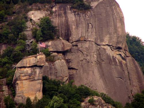 a mountain with an american flag on top of it at Holiday Inn Express & Suites Asheville SW - Outlet Ctr Area by IHG in Asheville