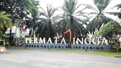a sign for the entrance to the mer merida international sign at Villa Samawa in Malang
