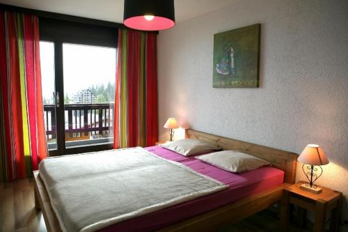 Ein Bett oder Betten in einem Zimmer der Unterkunft Residence Mandarin
