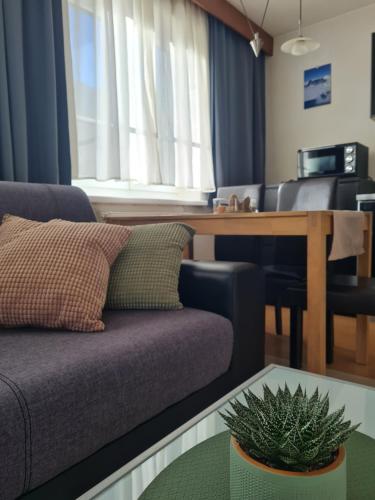 a living room with a couch and a table at Apartment Silvretta 