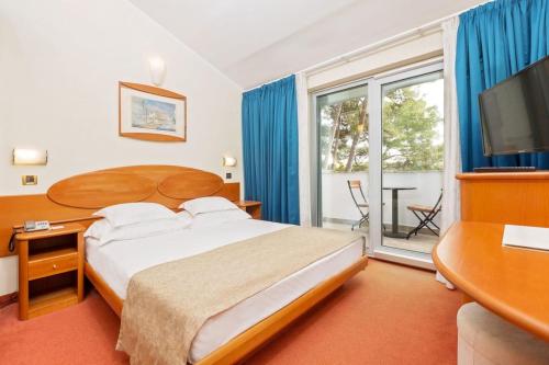 Кровать или кровати в номере Villa Galijot Plava Laguna