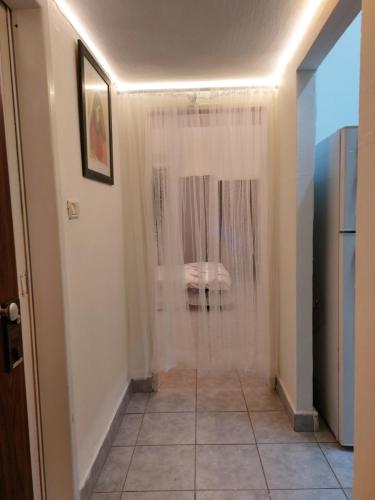a bathroom with a shower with a glass door at Modern Studio Central Haifa Free WiFi דירת נופש מאובזרת בחיפה in Haifa