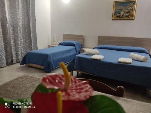 Ένα ή περισσότερα κρεβάτια σε δωμάτιο στο B&B Borgo Pileri