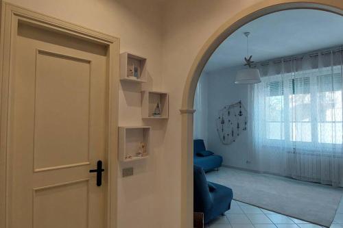 a hallway with a door and a living room at Il Nido di Marco a due passi dal mare in Portovenere