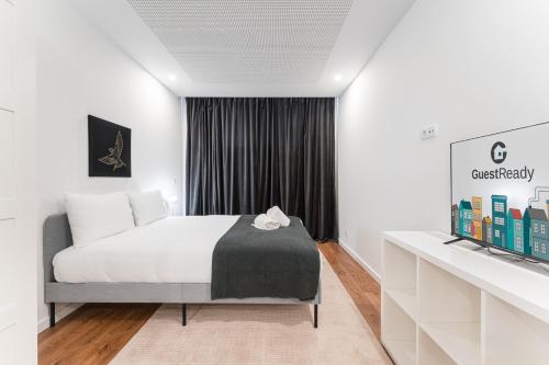 Postel nebo postele na pokoji v ubytování GuestReady - Uptown suites