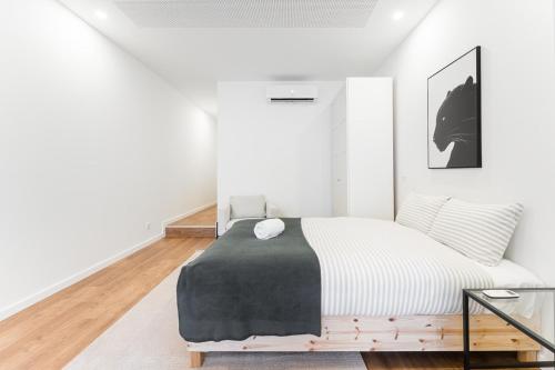 Postel nebo postele na pokoji v ubytování GuestReady - Uptown suites