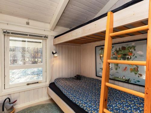 a bedroom with a bunk bed and a ladder at Holiday home Hals CXLI in Hals