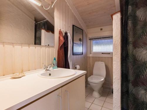a bathroom with a sink and a toilet at Holiday home Hals CXLI in Hals