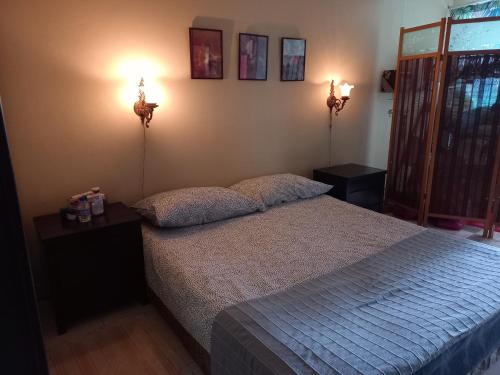 Кровать или кровати в номере Jerry's Homestay Batu Caves Gombak