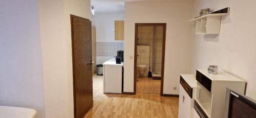 a bathroom with a sink and a toilet in a room at Ferienapartment Meiss in Erdeborn