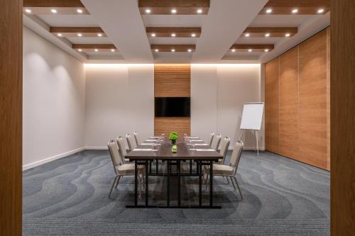 a conference room with a table and chairs at Hyatt Regency Lisbon in Lisbon