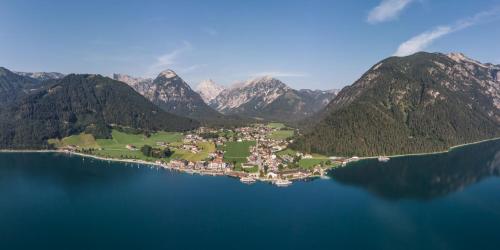 an island in the middle of a large body of water at NOVA Moments Boutique Hotel in Pertisau