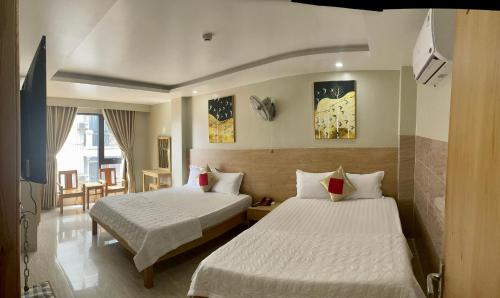 Giường trong phòng chung tại Sunrise Hotel Vung Tau