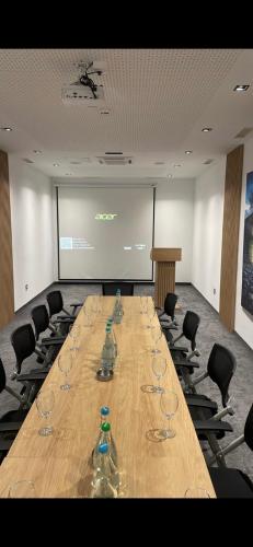 a conference room with a long table with wine glasses at HA Hotel Mostar in Mostar