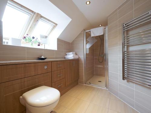 a bathroom with a toilet and a shower at Home Farm Cottages, Glendaruel, Argyll. Scotland in Clachan of Glendaruel